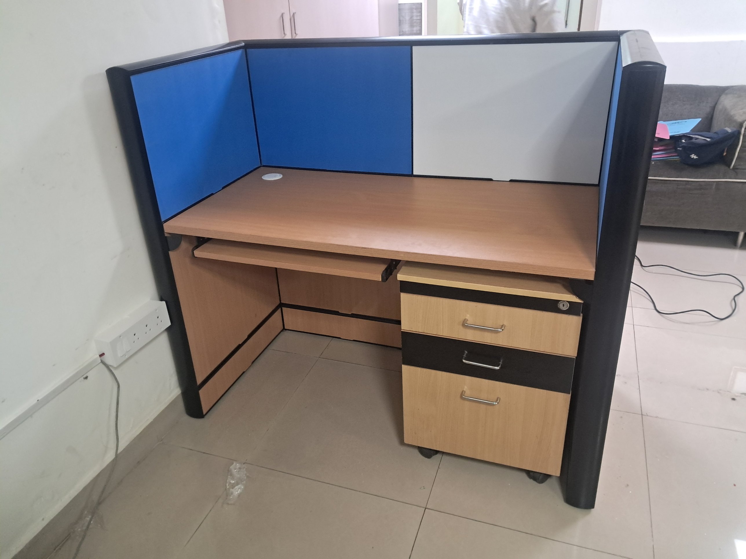 Compact single workstation with blue and grey privacy panels